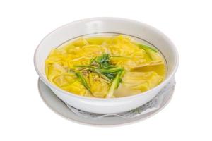 Chinese soup in a bowl on white background photo