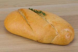 Baguette bread on wooden background photo