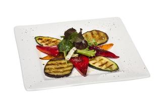 Grilled vegetables on the plate and white background photo