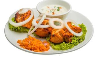 Chicken Tikka on the plate and white background photo