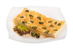 Olive bread on the plate and white background photo