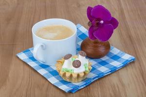 Creamy basket on wooden background photo