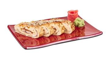 Omelet Maki Sushi - Roll made of Smoked Eel inside. Topped with Japanese Omelet and Sauce photo