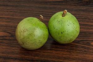 Sapote on wooden background photo