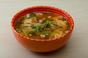 Soup Pho in a bowl on wooden background photo