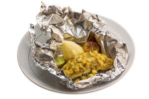 Baked catfish on the plate and white background photo