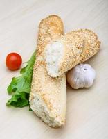 Baguette on wooden background photo