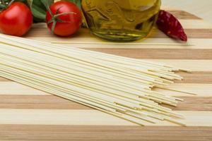 Egg spaghetti on wooden background photo