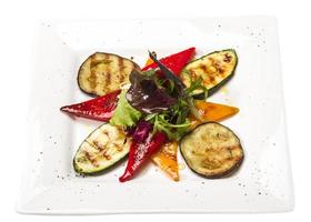 Grilled vegetables on the plate and white background photo