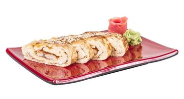 Omelet Maki Sushi - Roll made of Smoked Eel inside. Topped with Japanese Omelet and Sauce photo