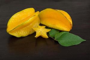 Carambola on wooden background photo