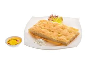 Olive bread on the plate and white background photo