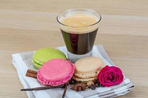 Macaroons delicious on wooden background photo