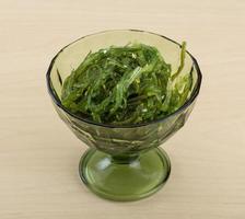 Chuka salad in a bowl on wooden background photo