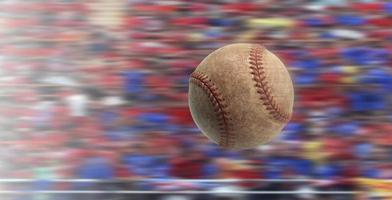 Baseball flies in fast motion in a competitive stadium photo