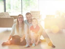 family with little boy enjoys in the modern living room photo