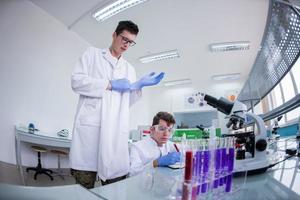 Group of young medical students doing research photo