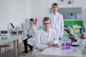 Group of young medical students doing research photo