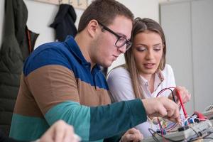 students doing practice in the electronic classroom photo