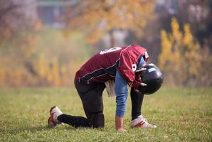 american football player resting after hard training photo