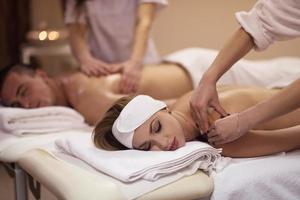 couple receiving a back massage photo