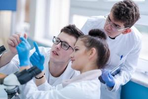 Group of young medical students doing research photo