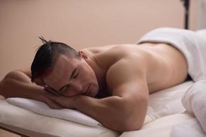 handsome man resting in a spa massage center photo