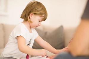 daughter painting nails to her pregnant mom photo