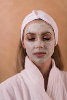 Spa Woman applying Facial Mask photo