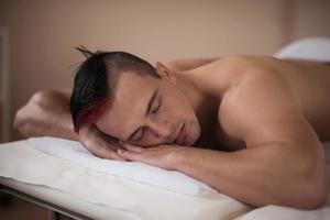 handsome man resting in a spa massage center photo