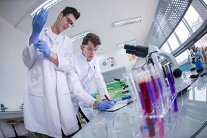 Group of young medical students doing research photo