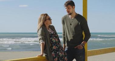 Couple chating and having fun at beach bar photo