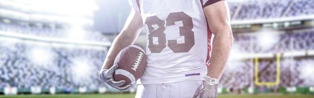 closeup American Football Player isolated on big modern stadium photo