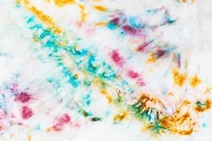 abstract spots of batik painted on white silk photo