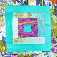 Square pattern of handmade patchwork cloth photo