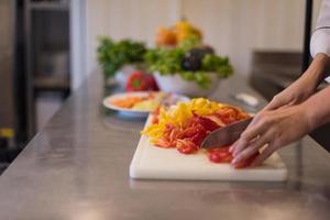 Chef cutting fresh and delicious vegetables photo
