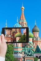 tourist taking photo of towers on Red Square