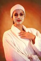 Spa Woman applying Facial Mask photo