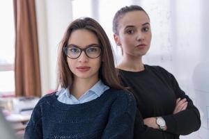 portrait of two young female students photo