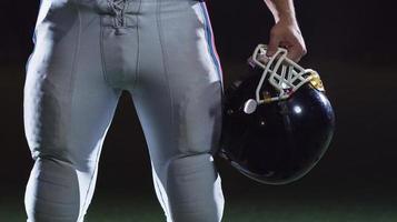 portrait of young confident American football player photo