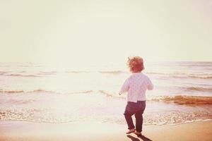 cute little girl at autumn beach photo