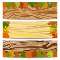 Autumn banners. Three autumn banners with yellow leaves on a wooden table. Vector illustration.