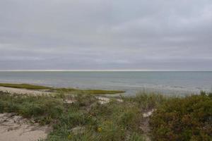 Beautiful landscape on the coast with a cloudy sky photo