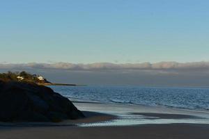 Pretty landscape on the coast of cape cod with a large jetty photo