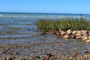 Waves turning into ripples onto the cape cod coast photo