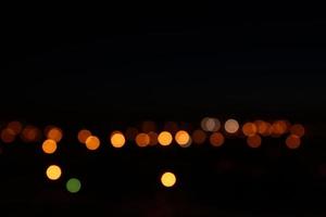 Night lights bokeh background. City flashlights defocused photo