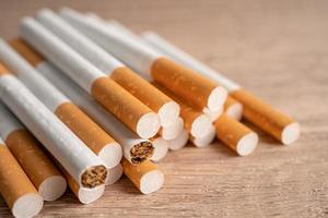 Cigarette, tobacco in roll paper with filter tube, No smoking concept. photo