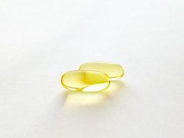 Closed capsules with dietary supplement, fish oil, omega 3 photo
