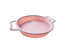 New round silicone baking dish with handles isolated on white background. photo