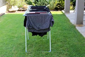 Washed clothes and linen dries on the balcony. photo